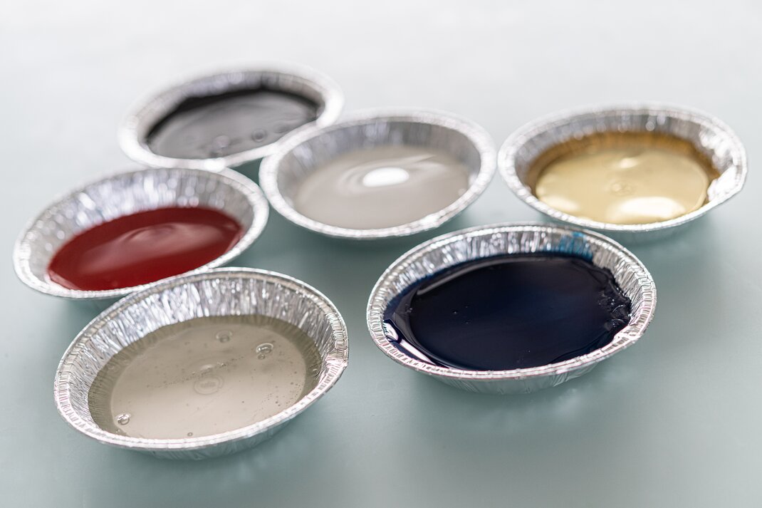 Colored hot melt adhesives from artimelt
